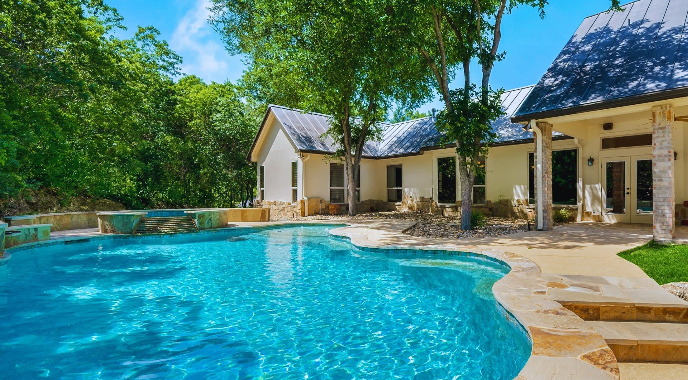 Clean residential pool and outdoor living space in the Lake Travis area